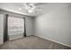 Well-lit bedroom with neutral wall colors and carpet flooring at 3660 Se 54Th Ave, Ocala, FL 34480