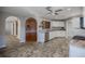 Modern kitchen with white cabinets, stainless steel appliances, and granite countertops at 3660 Se 54Th Ave, Ocala, FL 34480