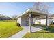 Exterior view of a storage shed with covered patio at 3660 Se 54Th Ave, Ocala, FL 34480