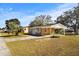 Tan house with carport, viewed from across the street at 3766 Sw 147Th Lane Rd, Ocala, FL 34473