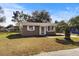 Tan single story house with a palm tree in the front yard at 3766 Sw 147Th Lane Rd, Ocala, FL 34473