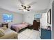 Bedroom with double bed, dresser, and window at 3805 Se 138Th Pl, Summerfield, FL 34491