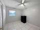 Simple bedroom with tiled floors and dresser at 3805 Se 138Th Pl, Summerfield, FL 34491