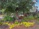 Landscaped garden with mature trees and plants at 3805 Se 138Th Pl, Summerfield, FL 34491