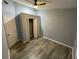 Bedroom with closet and wood-look flooring at 4503 Oak Arbor Cir, Orlando, FL 32808