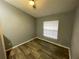 Bright bedroom with wood-look floors and ceiling fan at 4503 Oak Arbor Cir, Orlando, FL 32808