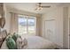 Bright bedroom with large window and ample closet space at 4709 Se 25Th Loop, Ocala, FL 34480