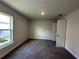 Bright bedroom with large window, carpet, and spacious closet at 5110 Sw 92Nd St, Ocala, FL 34476