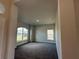 Spacious bedroom with large window and neutral color palette at 5110 Sw 92Nd St, Ocala, FL 34476