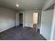 Spacious bedroom with carpet, double door closet and access to bathroom at 5110 Sw 92Nd St, Ocala, FL 34476