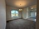 Bright dining room with large window and chandelier at 5110 Sw 92Nd St, Ocala, FL 34476