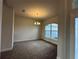 Dining room with large window and chandelier at 5110 Sw 92Nd St, Ocala, FL 34476