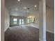 Open living room with view into kitchen and backyard at 5110 Sw 92Nd St, Ocala, FL 34476