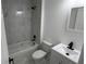 Clean bathroom, featuring a bathtub, toilet, and white vanity at 5363 Nw 3Rd St, Ocala, FL 34482