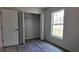 Bedroom with neutral paint, durable floors, and a closet perfect for storage at 5363 Nw 3Rd St, Ocala, FL 34482