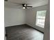 Bright bedroom with ceiling fan and vinyl plank flooring at 5363 Nw 3Rd St, Ocala, FL 34482