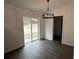 Spacious dining area with vinyl plank flooring and sliding glass doors at 5363 Nw 3Rd St, Ocala, FL 34482