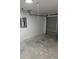 Unfinished garage with concrete floor and electric panel at 5363 Nw 3Rd St, Ocala, FL 34482