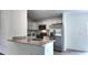 Modern kitchen with stainless steel appliances, granite countertops, and ample cabinet space at 5363 Nw 3Rd St, Ocala, FL 34482