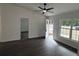 Open living room with hardwood floors, high ceilings, and access to the outdoors at 5363 Nw 3Rd St, Ocala, FL 34482