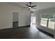 Open living room with hardwood floors, high ceilings, and access to the outdoors at 5363 Nw 3Rd St, Ocala, FL 34482