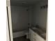 Bathroom with double sinks, gray countertops, white subway tile and modern fixtures at 5411 Nw 7Th Pl, Ocala, FL 34482