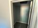 Walk in closet with light gray walls and wood style flooring at 5411 Nw 7Th Pl, Ocala, FL 34482