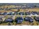 Aerial view of houses in a neighborhood near a golf course at 5503 Nw 25Th Loop, Ocala, FL 34482