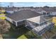 Aerial view of home with pool and screened enclosure at 5503 Nw 25Th Loop, Ocala, FL 34482