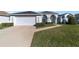 House with attached garage and manicured lawn at 5503 Nw 25Th Loop, Ocala, FL 34482