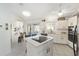 Modern kitchen with white cabinets, an island, and stainless steel appliances at 5503 Nw 25Th Loop, Ocala, FL 34482