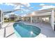 Relaxing pool area with covered patio and seating at 5503 Nw 25Th Loop, Ocala, FL 34482