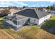 Aerial view of house with a screened pool and patio at 5503 Nw 25Th Loop, Ocala, FL 34482