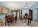 Formal dining room with a large table and chandelier at 5824 Sw 100Th Ln, Ocala, FL 34476