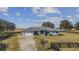 House with a large yard and wooden fence at 630 Sw 210Th Ave, Dunnellon, FL 34431