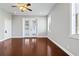 Bedroom with hardwood floors and French doors at 630 Sw 210Th Ave, Dunnellon, FL 34431