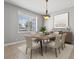 Bright dining room with a modern light fixture at 630 Sw 210Th Ave, Dunnellon, FL 34431