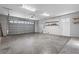 Spacious garage with concrete floor and shelving at 630 Sw 210Th Ave, Dunnellon, FL 34431