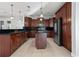 Kitchen with dark wood cabinets and granite countertops at 630 Sw 210Th Ave, Dunnellon, FL 34431