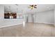 Open living room with tile floors and kitchen view at 630 Sw 210Th Ave, Dunnellon, FL 34431