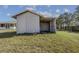 White storage shed with open sides and grassy yard at 630 Sw 210Th Ave, Dunnellon, FL 34431