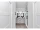 Bathroom featuring double sinks with granite countertops, modern fixtures, and a glass-enclosed shower at 7646 Sw 129Th Pl, Ocala, FL 34473