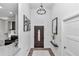 View of entryway with kitchen and dark door at 7646 Sw 129Th Pl, Ocala, FL 34473