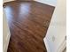 Bedroom with dark brown laminate flooring at 8512 Sw 136Th Pl, Ocala, FL 34473