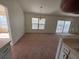 Bright dining area with carpeted floors and chandelier at 8512 Sw 136Th Pl, Ocala, FL 34473