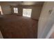 Bright living room featuring sliding glass doors and carpet at 8512 Sw 136Th Pl, Ocala, FL 34473