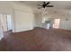 Spacious living room with vaulted ceilings and carpet flooring at 8512 Sw 136Th Pl, Ocala, FL 34473