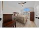 A bedroom featuring neutral walls, light wood floors, and a large window for natural light at 8822 Sw 108Th St, Ocala, FL 34481