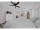 A well-lit main bedroom featuring light wood floors and neutral decor at 8822 Sw 108Th St, Ocala, FL 34481