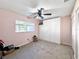 Spacious bedroom with built-in closet and ceiling fan at 9395 Sw 97Th Ln # B, Ocala, FL 34481